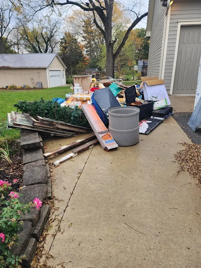 Dumpster being loaded with debris for 30 Yard Dumpster Rental in Highlands